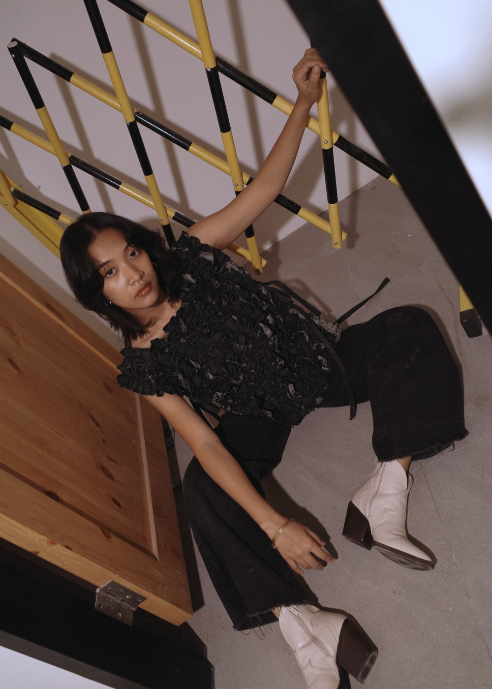 ruffle bib - black denim