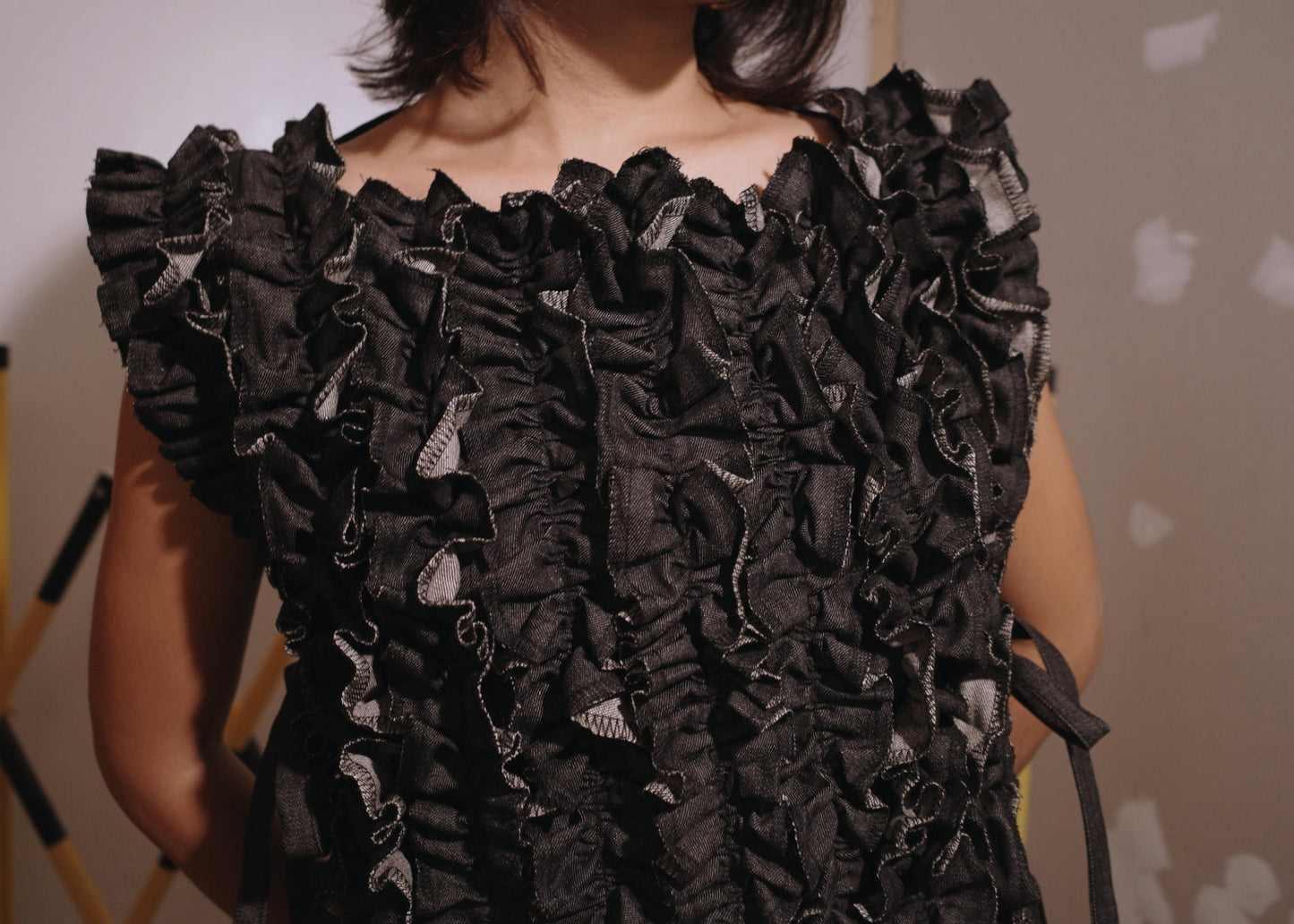 ruffle bib - black denim